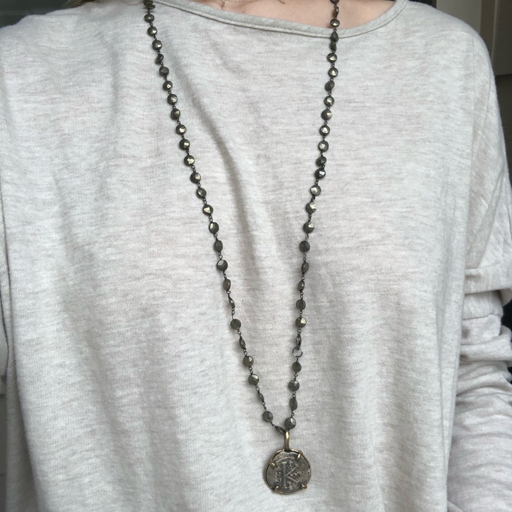 Gray beaded necklace with coin charm